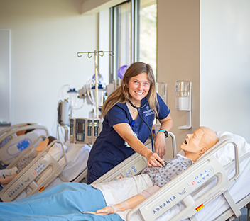 nursing student in sim lab