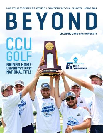 mens golf team with championship trophy