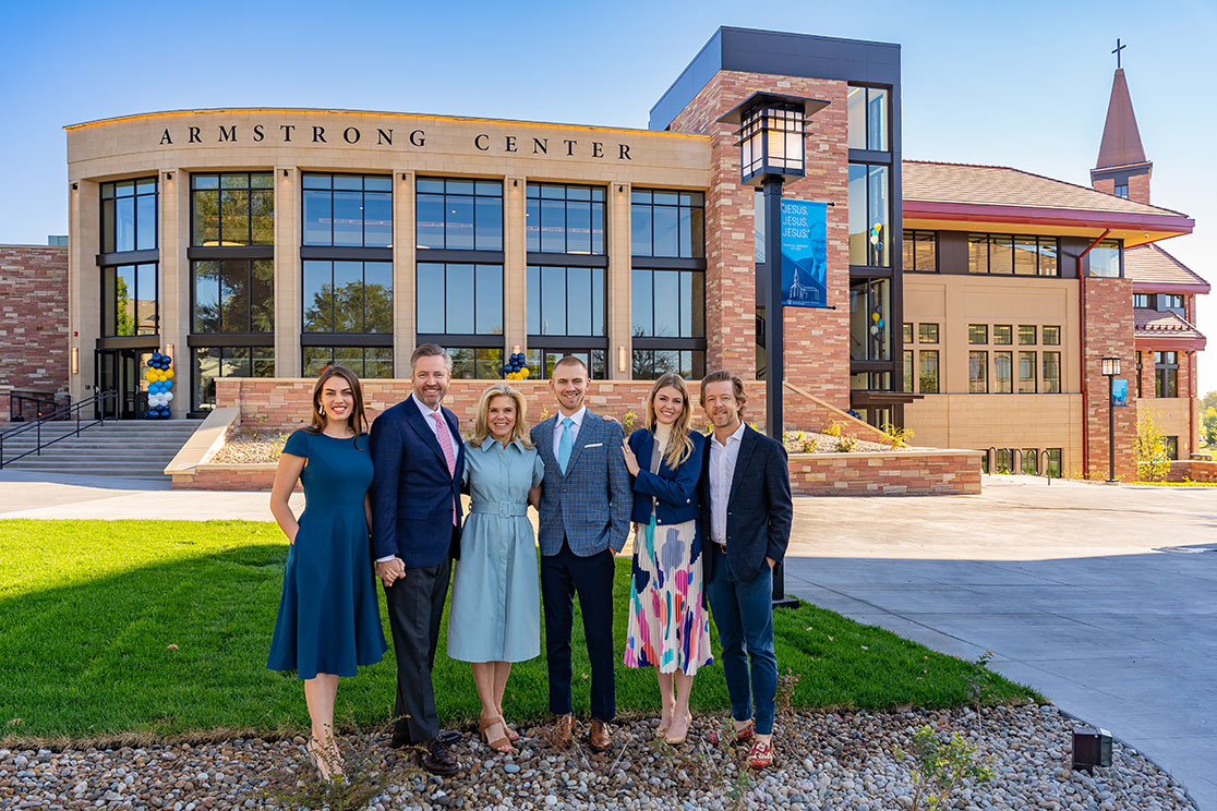 The Armstrong family standing in front of the newly completed Armstrong Center.